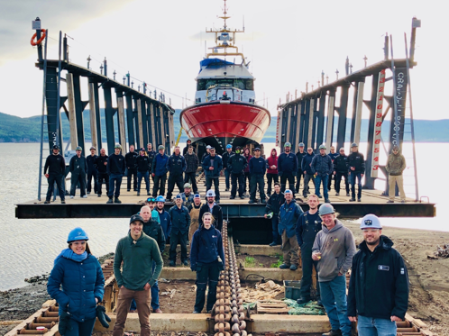 Shipyard crew in front of ship