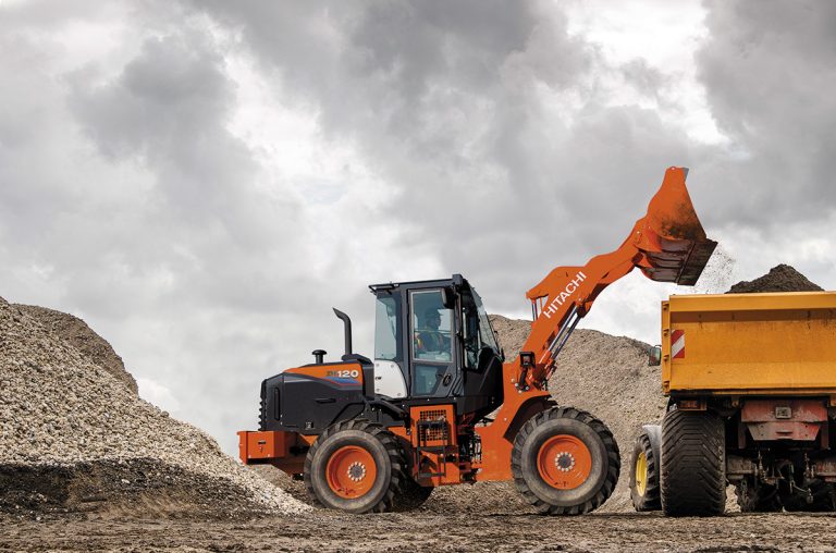 Hitachi ZW120 Wheel Loader offloading into dump truck