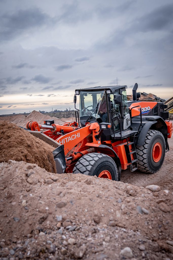 Hitachi ZW330 Wheel Loader Scooping Dirt